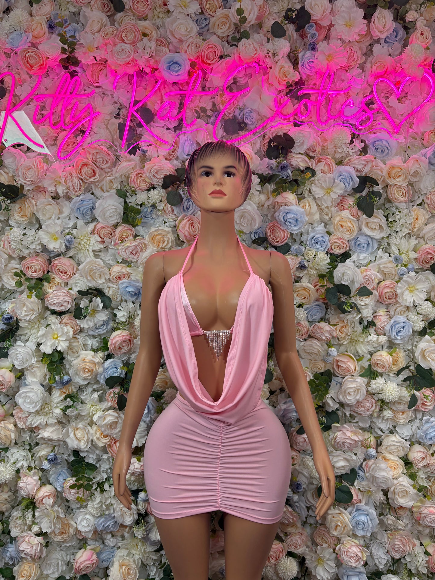 Pink halter mini dress with draped cowl neckline and ruched skirt
