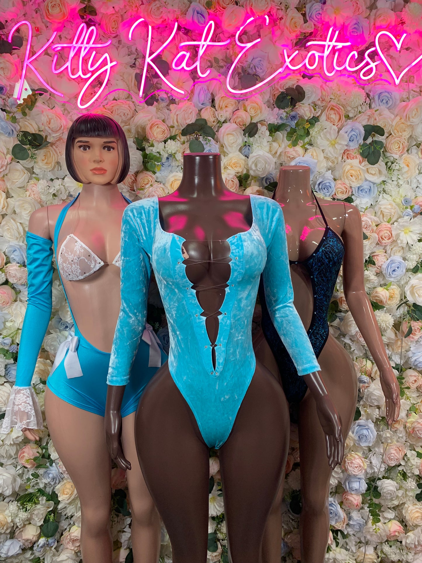 Turquoise long-sleeve one-piece rave bodysuit with deep V neckline