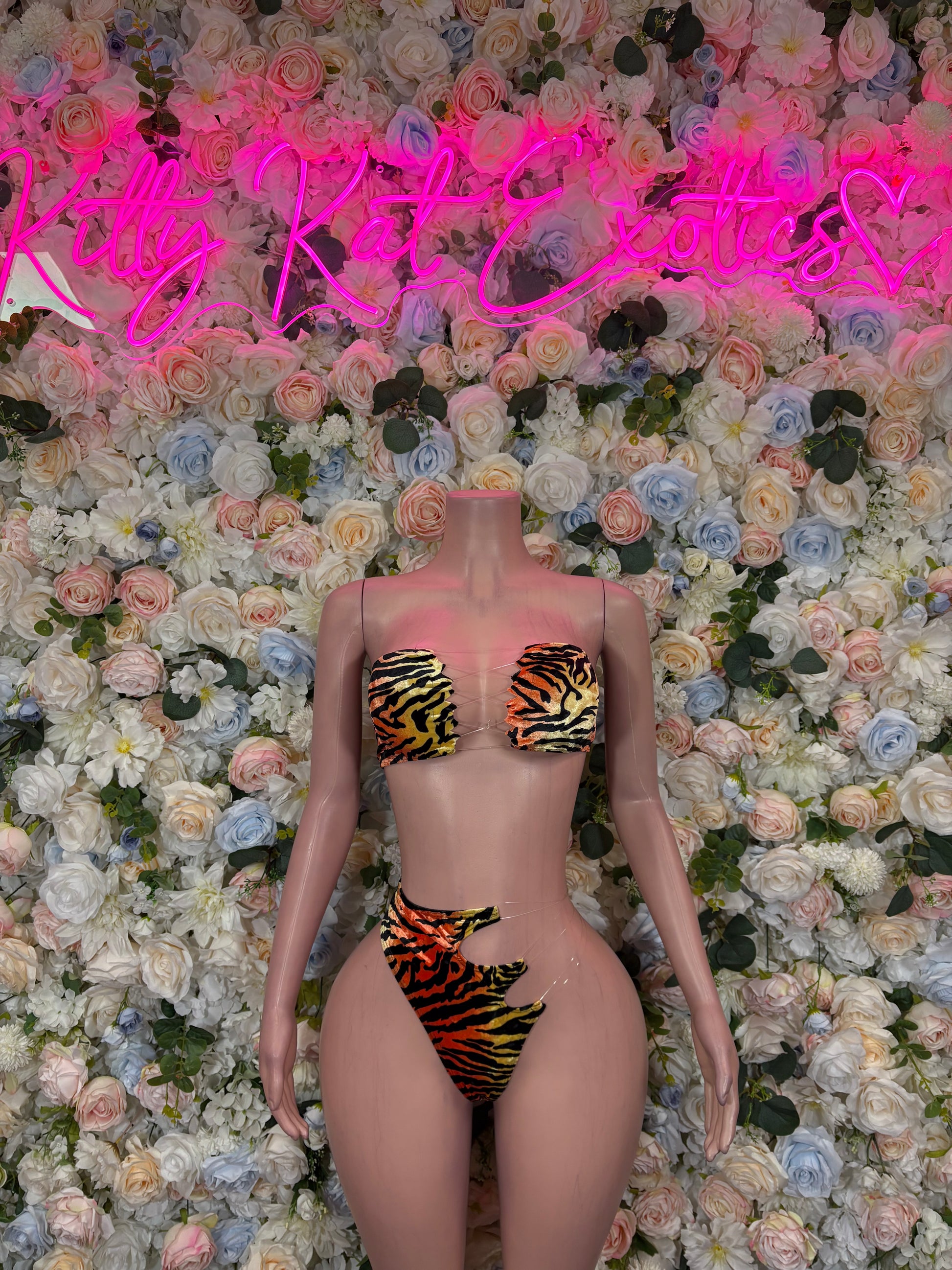 Tiger-print two-piece bikini front view with bandeau top and high-cut bottoms, orange and black