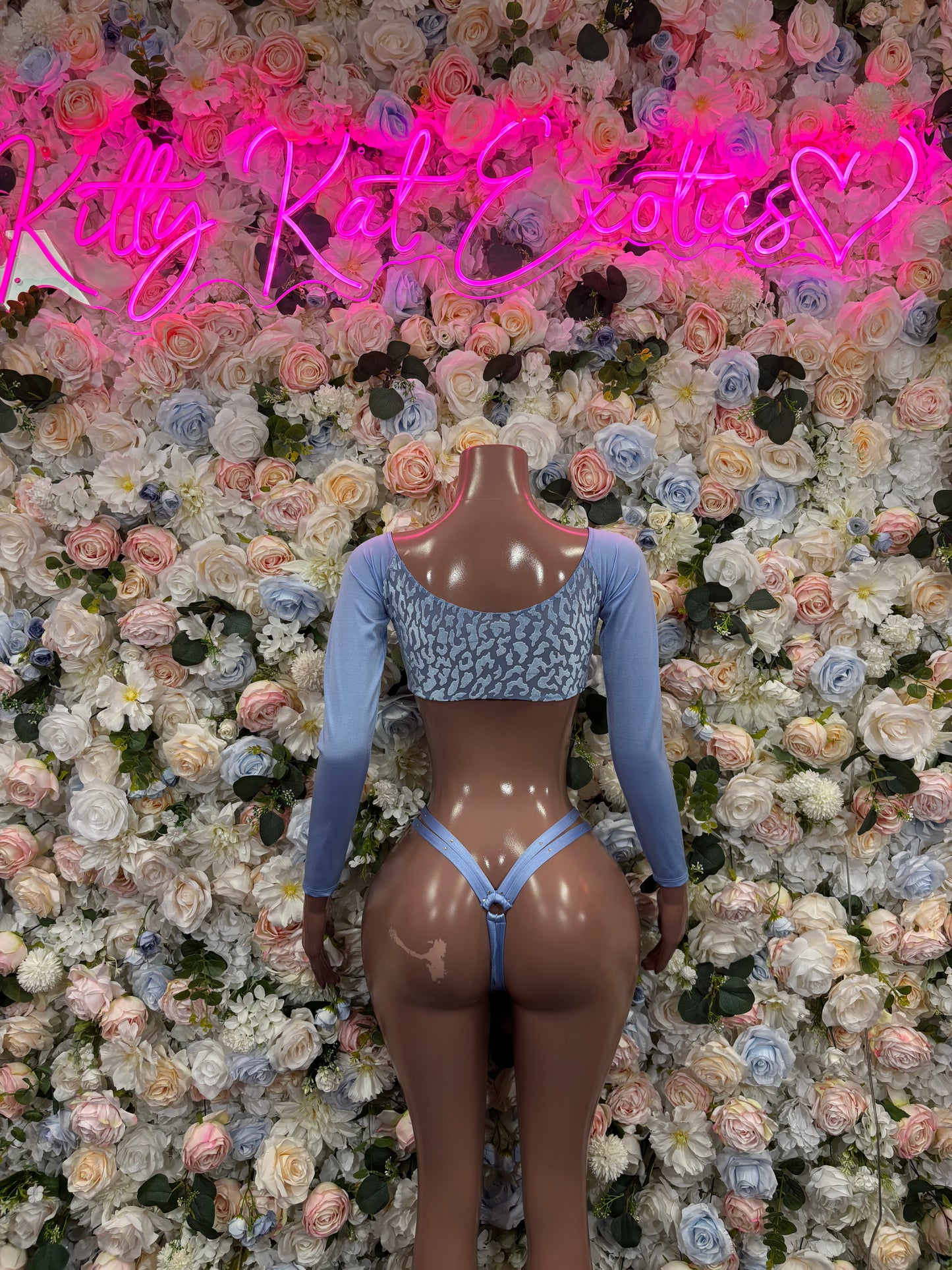 Light blue lace-front two-piece rave outfit with long sleeves, front view on mannequin