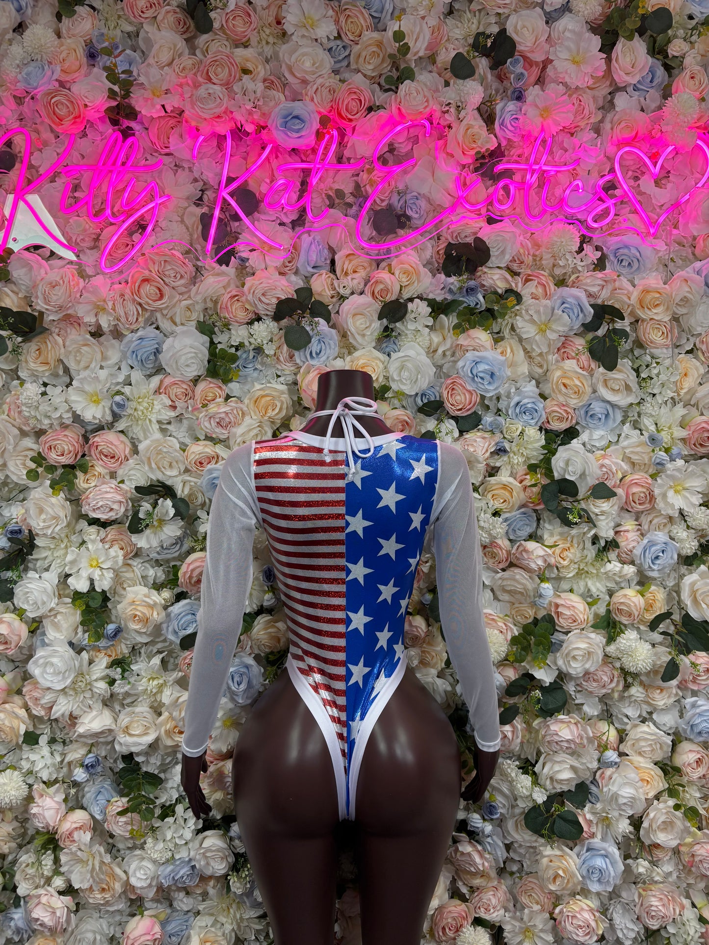 US flag bodysuit with long sleeves, star-and-stripe sides and lace-up waist