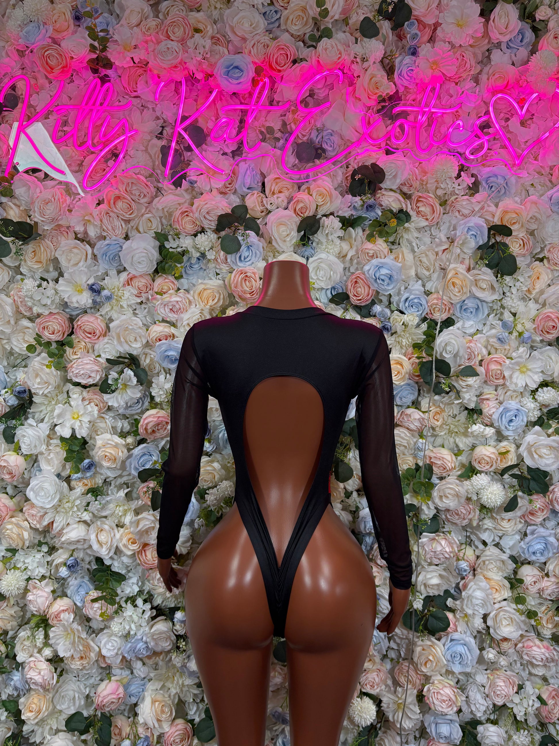 Black sheer long-sleeve bodysuit with red print and open back cutout