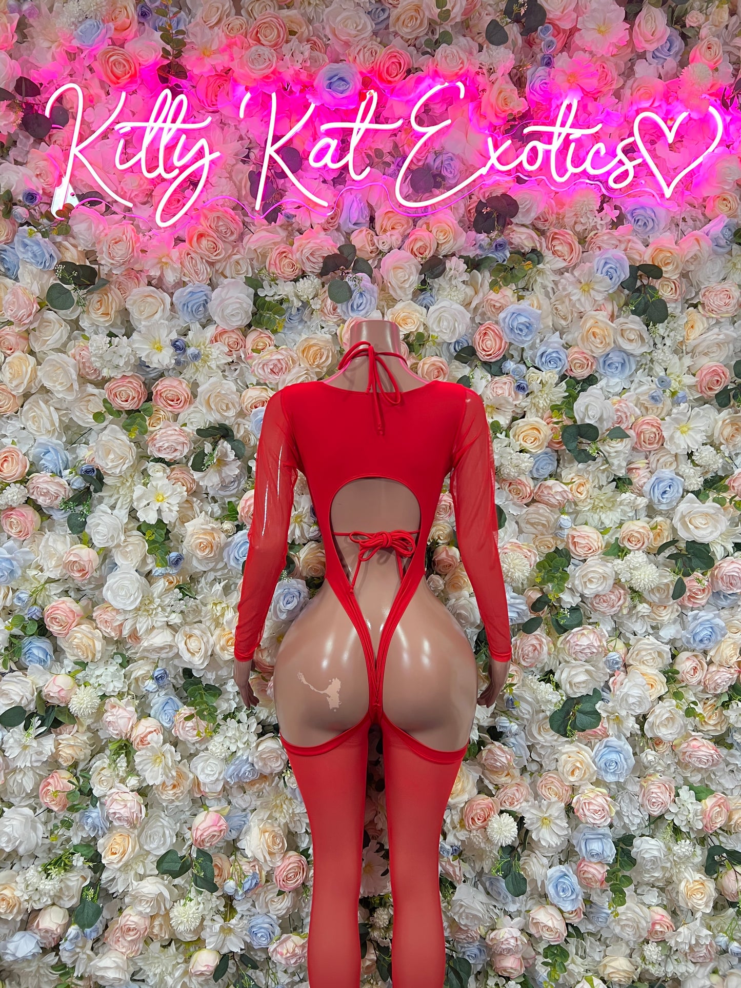 Red heart bodysuit with open back cutouts and long sleeves, lace-up front