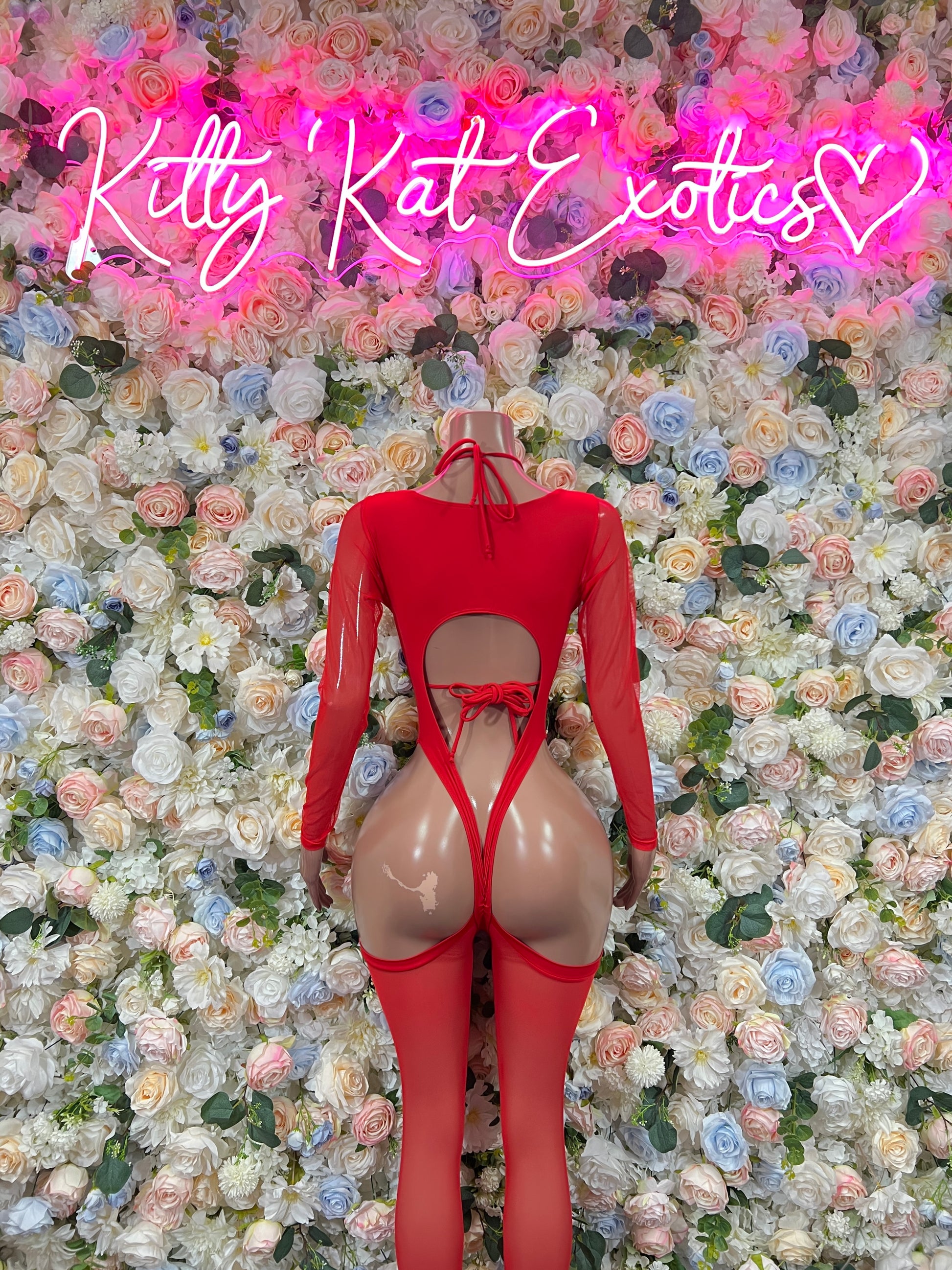Red heart bodysuit with open back cutouts and long sleeves, lace-up front