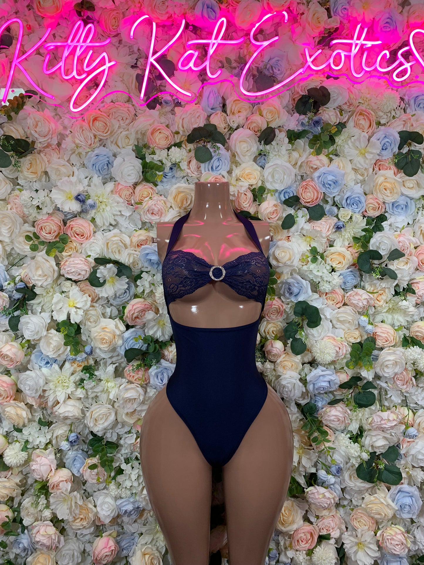 Blue one-piece bodysuit with halter neckline and lace panel front