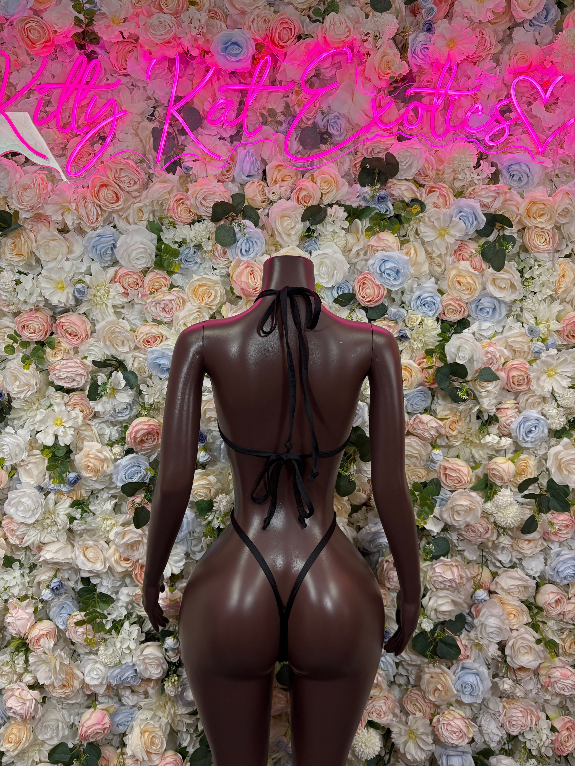 Cheetah print one-piece dancewear bodysuit, pink/orange accents, open back with crisscross straps