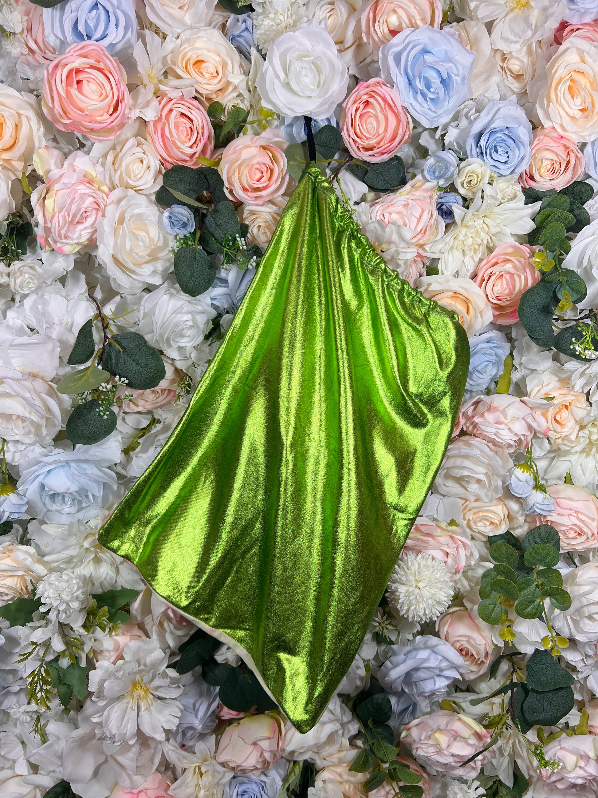 Metallic drawstring money bag in bright green with shiny pleated texture