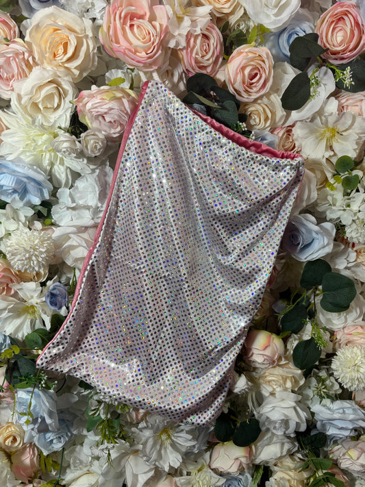 White-and-pink dotted money bag with dark trim and gathered drawstring top