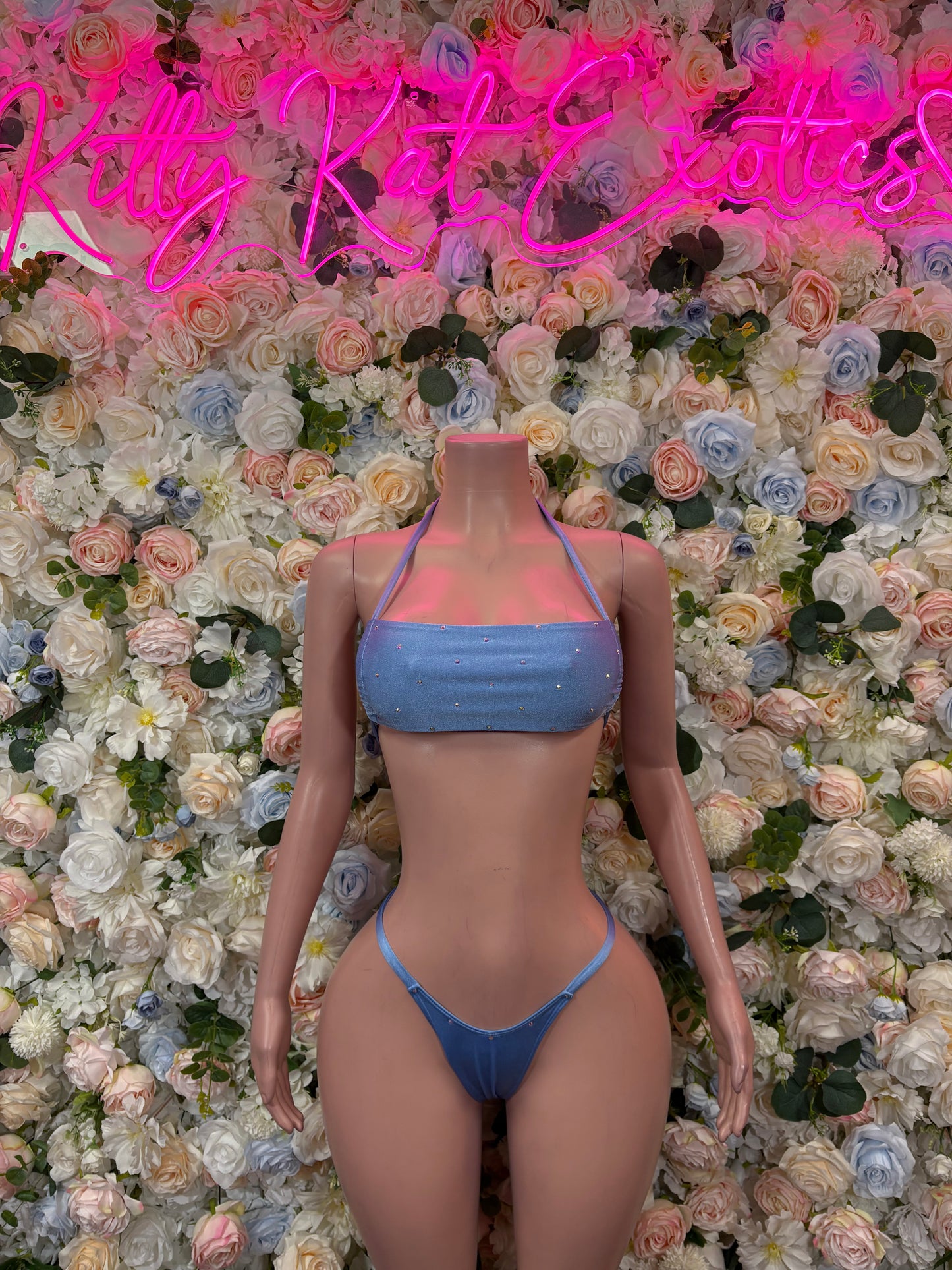 Blue bikini set with ruched bandeau crop top and triangle tie-side bottoms