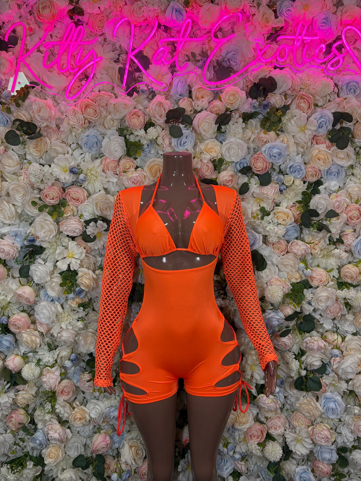 Orange one-piece bodysuit with mesh long sleeves, bra-style top and lace-up side ties