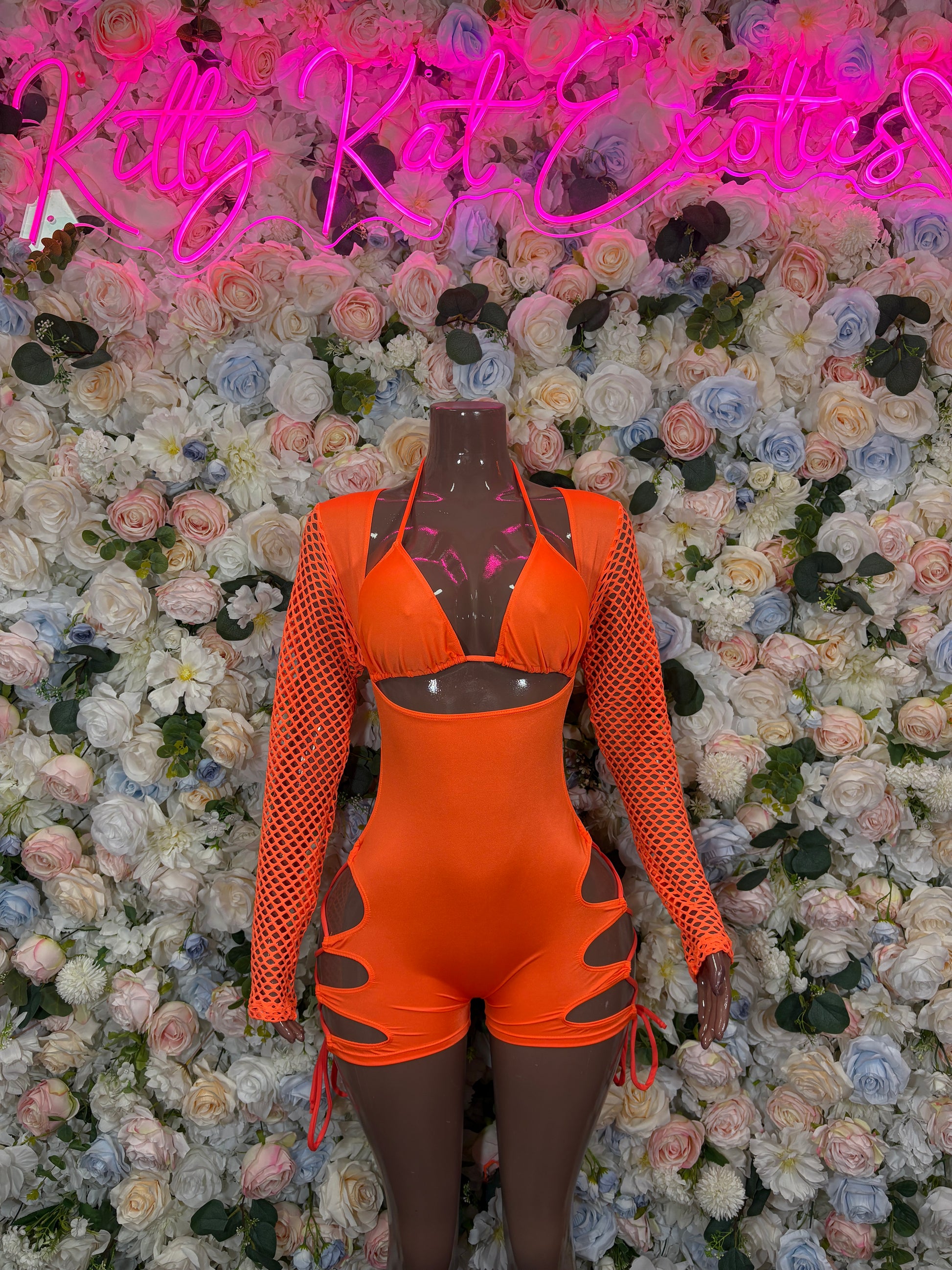 Orange one-piece bodysuit with mesh long sleeves, bra-style top and lace-up side ties