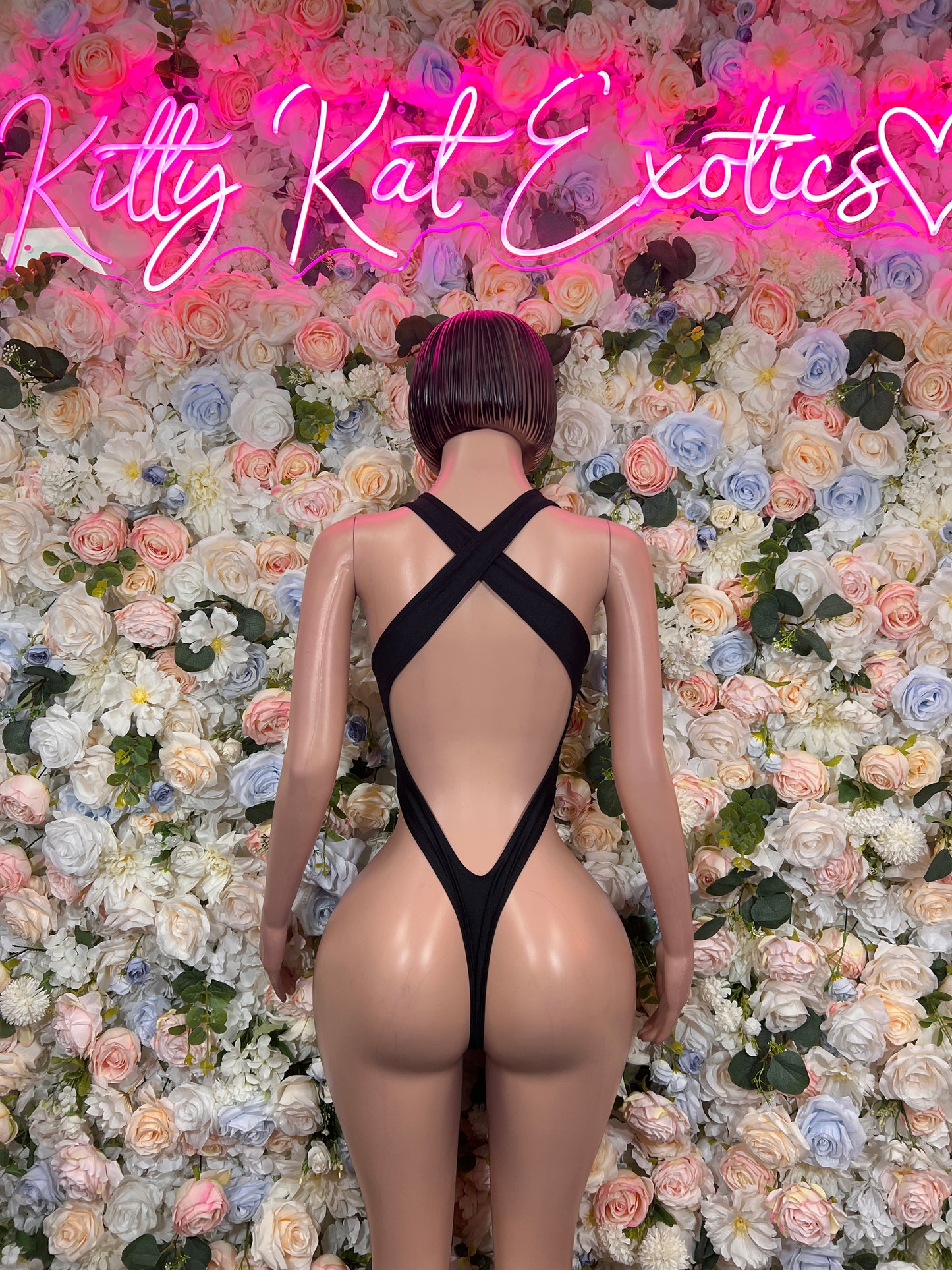Black halter bodysuit with open back and crisscross straps