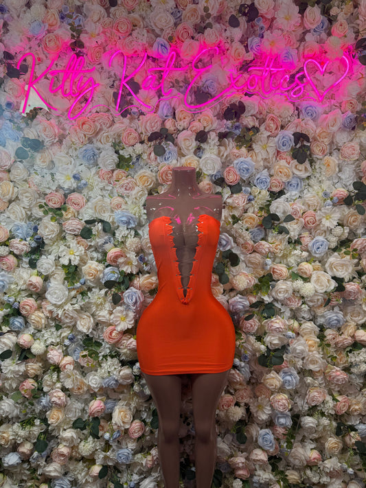 Orange halter mini dress on mannequin, ruched cups and open-back silhouette