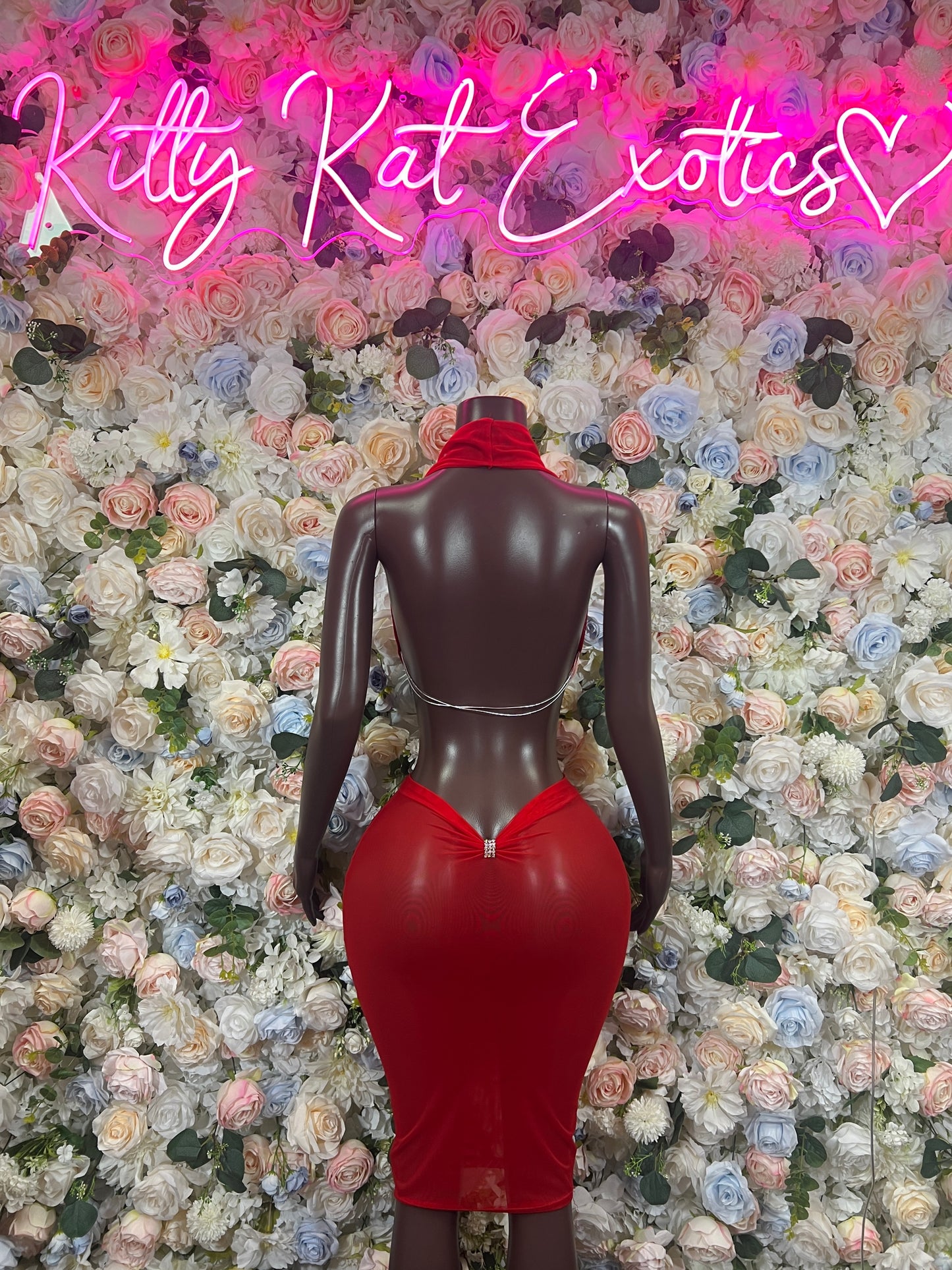 Red fitted halter dance dress with low back and center seam, back view