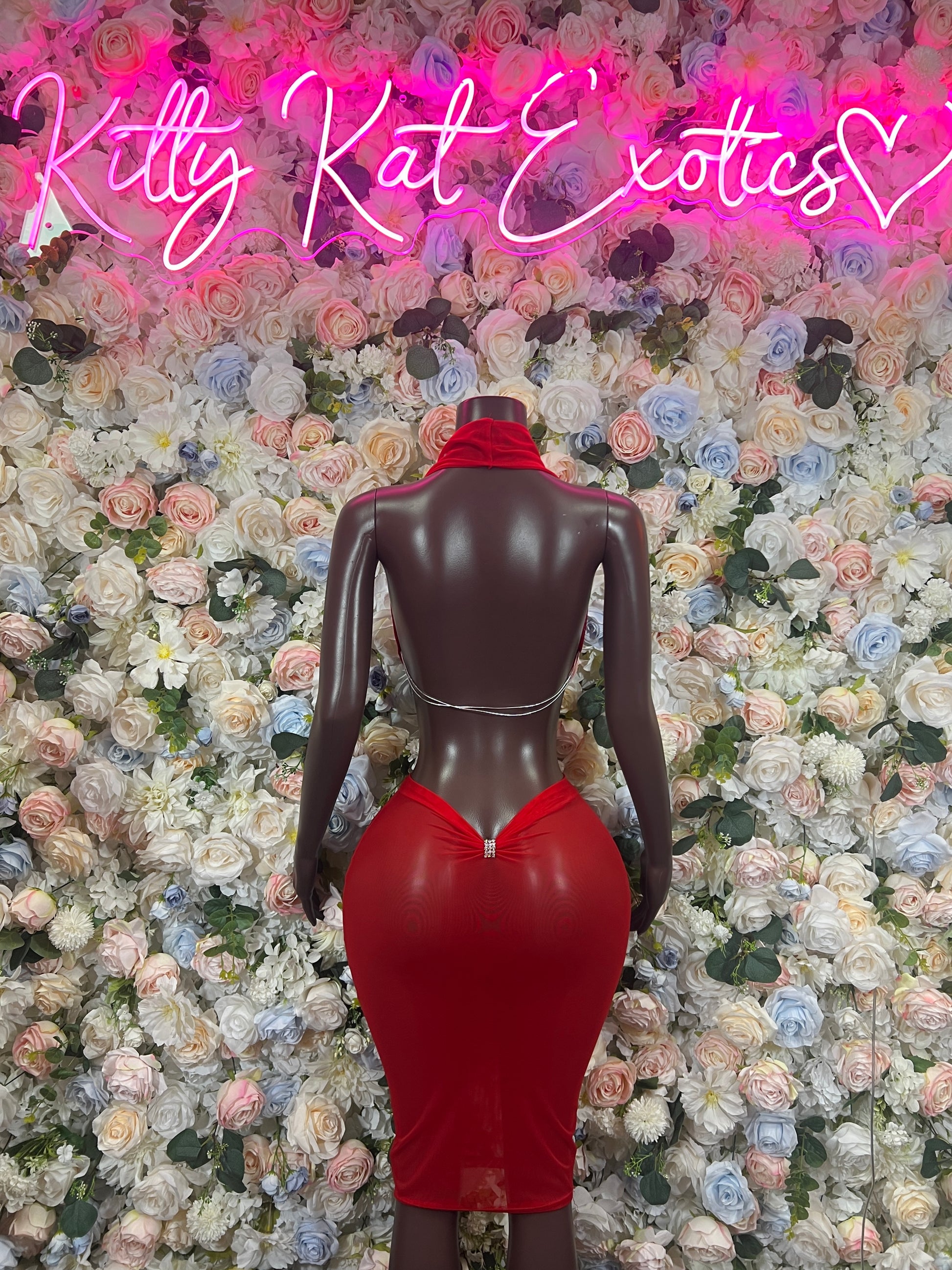 Red fitted halter dance dress with low back and center seam, back view