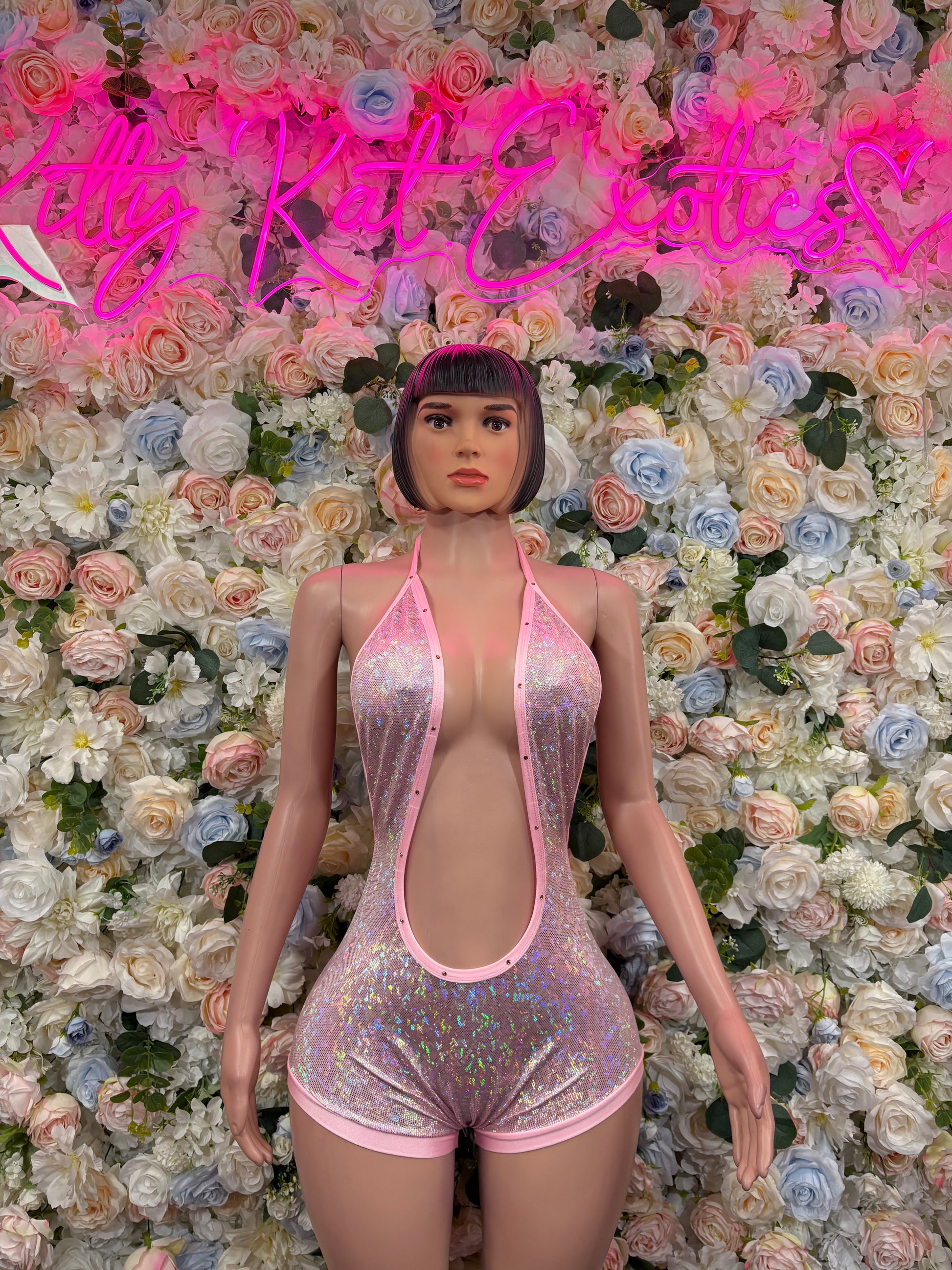 Sparkly pink metallic one-piece bodysuit with deep V front and high-cut legs
