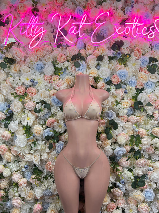 Nude two-piece bikini set with triangle top and thong-style bottoms, tie straps