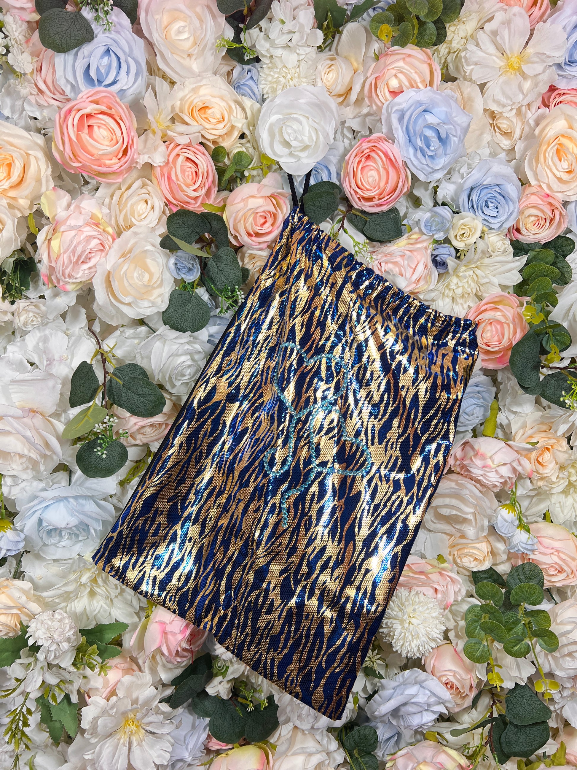 Blue leopard-print money bag with metallic gold and navy top edge