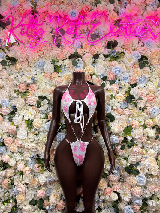 Dark sheer two-piece bodysuit with multicolor cow-print panels and lace-up front tie