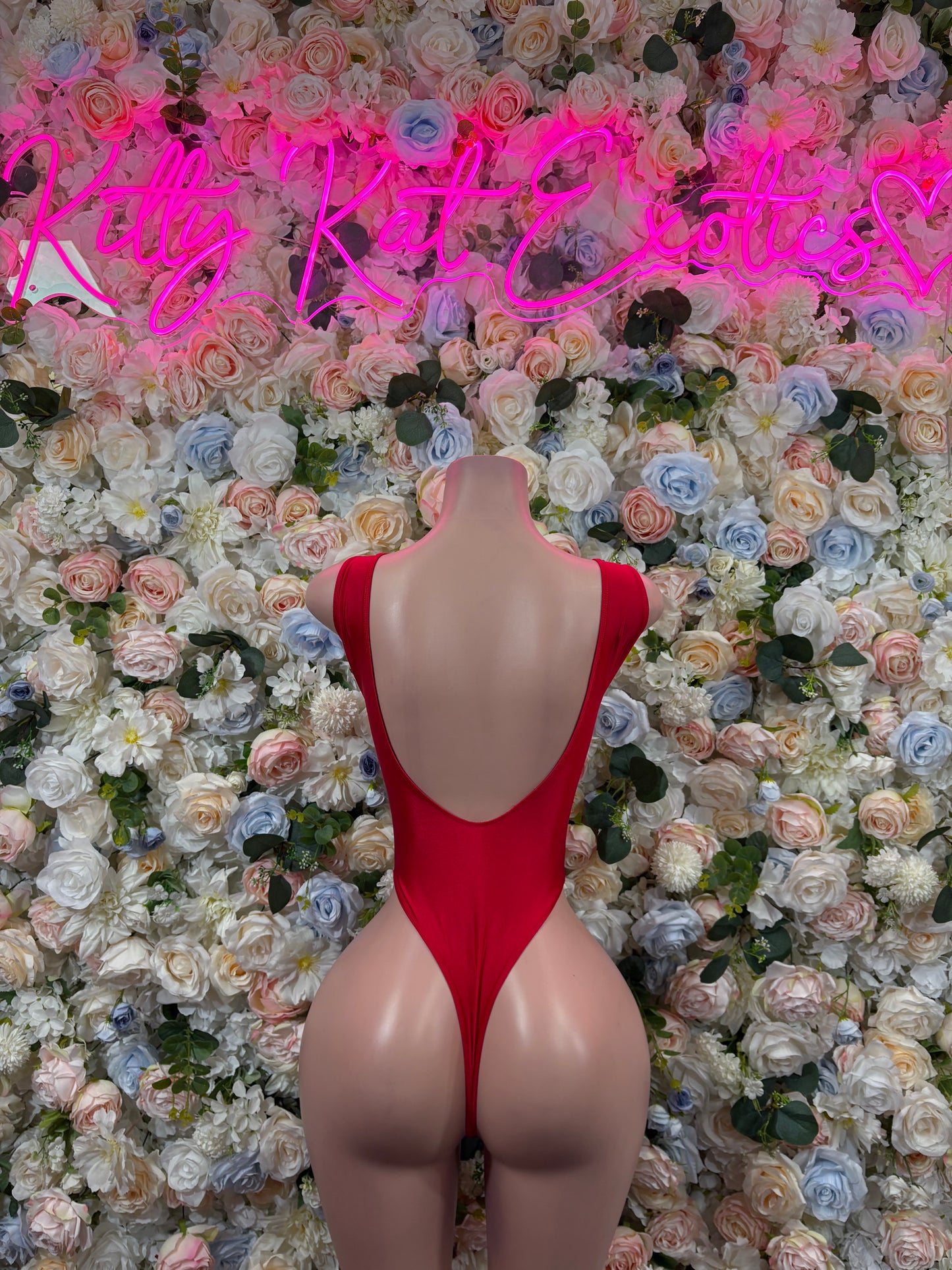 Red glitter backless bodysuit with scoop back and thong cut, mannequin