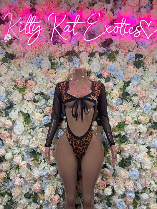 Leopard print bodysuit with black sheer sleeves and bow-tied open back