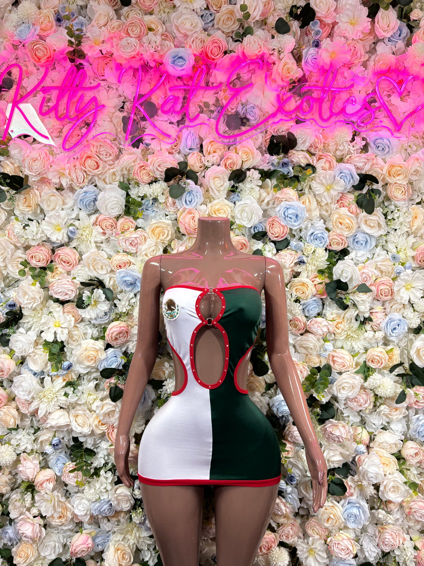 Women’s festival dress with green and white panels, red trim, corset-style bodice