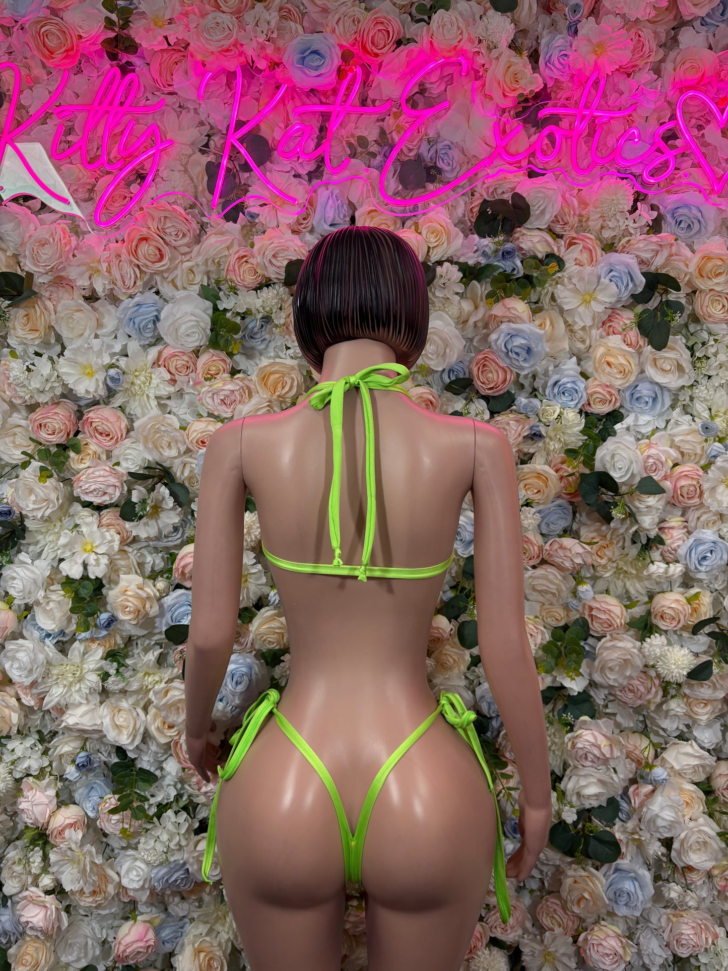 Neon green string bikini with back tie straps and V-shaped thong bottoms