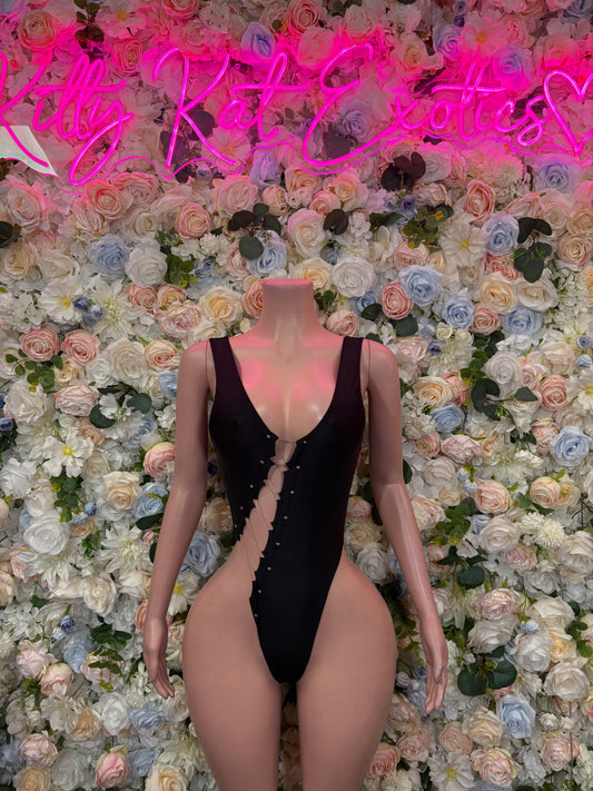 Black one-piece bodysuit with deep V neckline and lace-up front, sleeveless