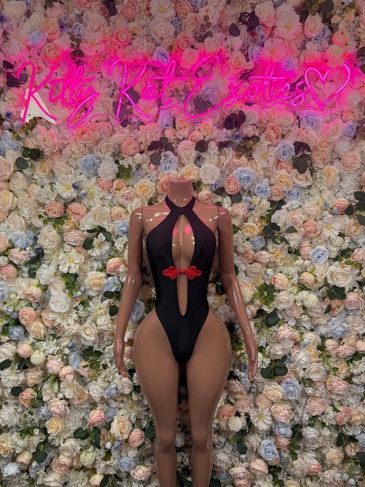 Black one-piece rave bodysuit with halter neckline and red heart cutout at chest