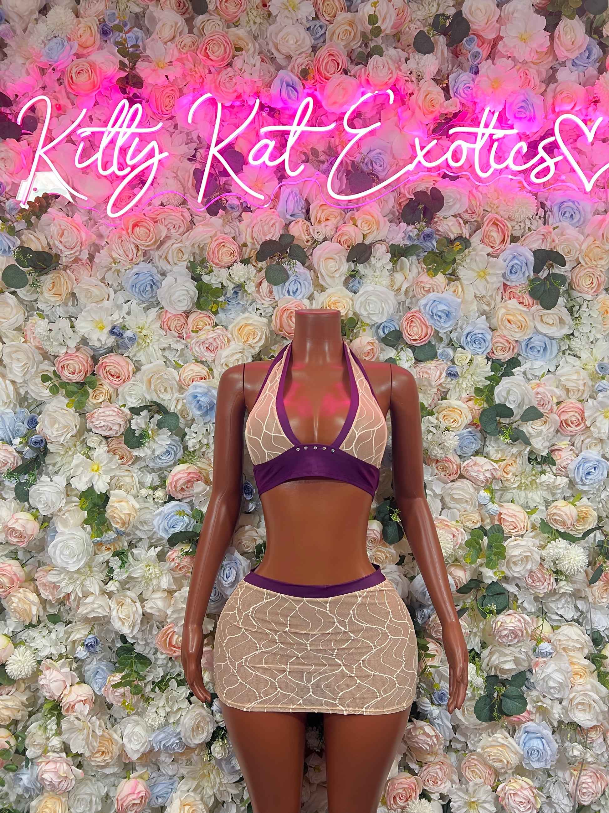 Two-piece dancewear skirt set: purple halter top with tan patterned mini skirt