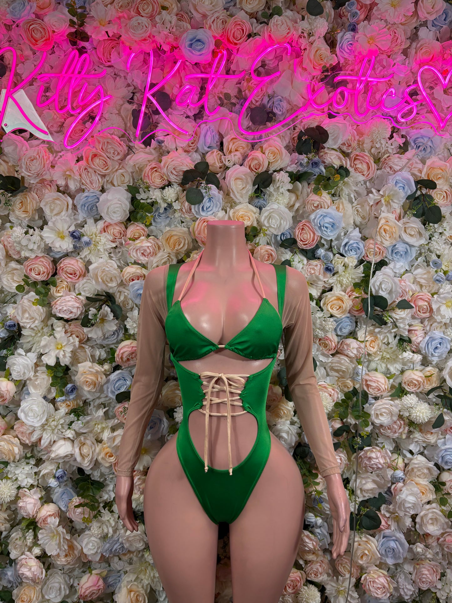 Green lace-up cutout bodysuit with triangle neckline and thong-style coverage