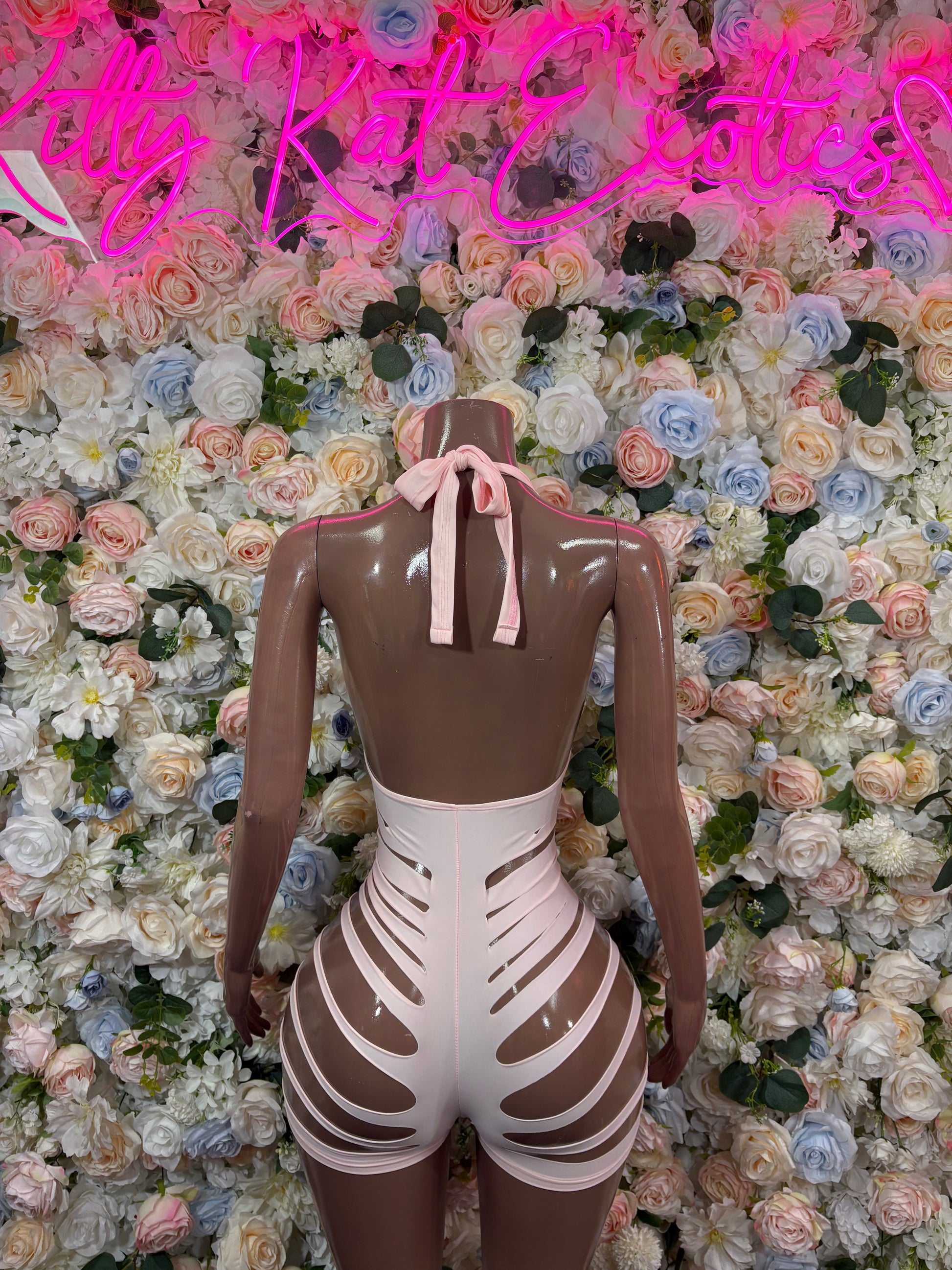 Baby pink halter bodysuit with back bow ties and white ribbed cutout front