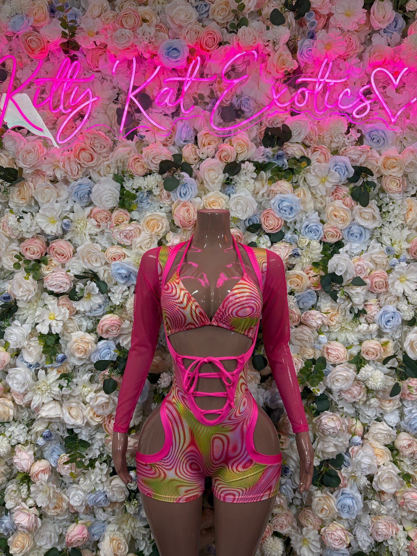 Pink metallic hologram dancewear set with long sleeves, strappy front, high-cut shorts
