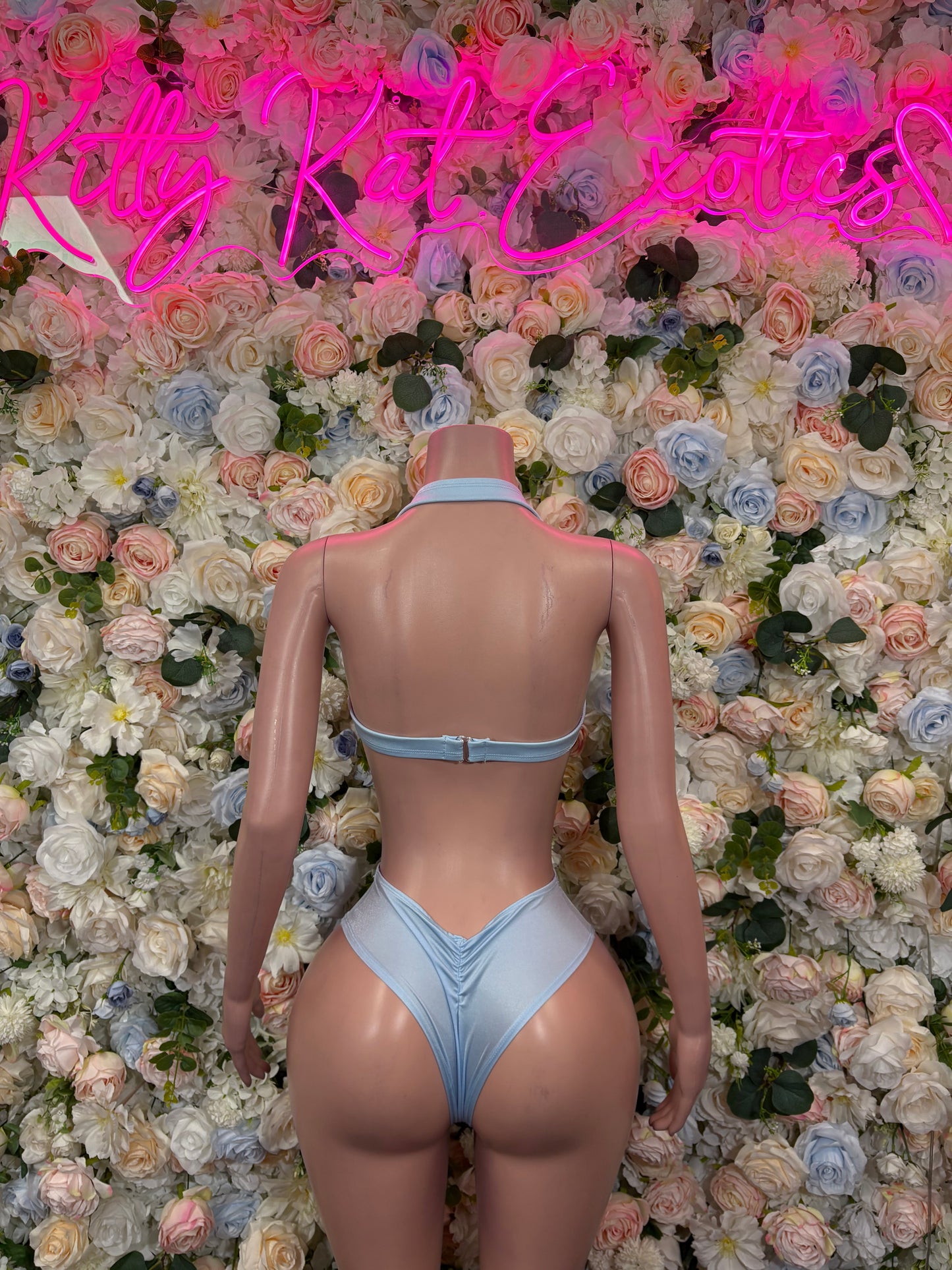 Light blue two-piece rave outfit with lace-up back cropped top and high-rise bottoms