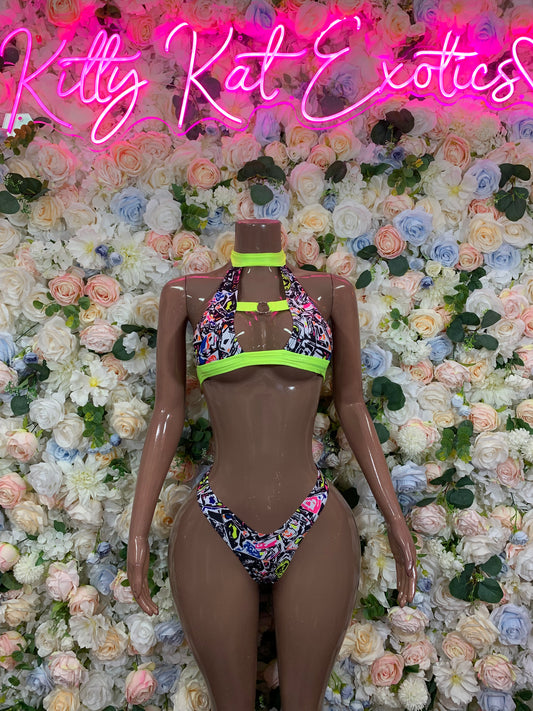 Multicolor patterned bikini with neon green chest band and high-cut bottoms