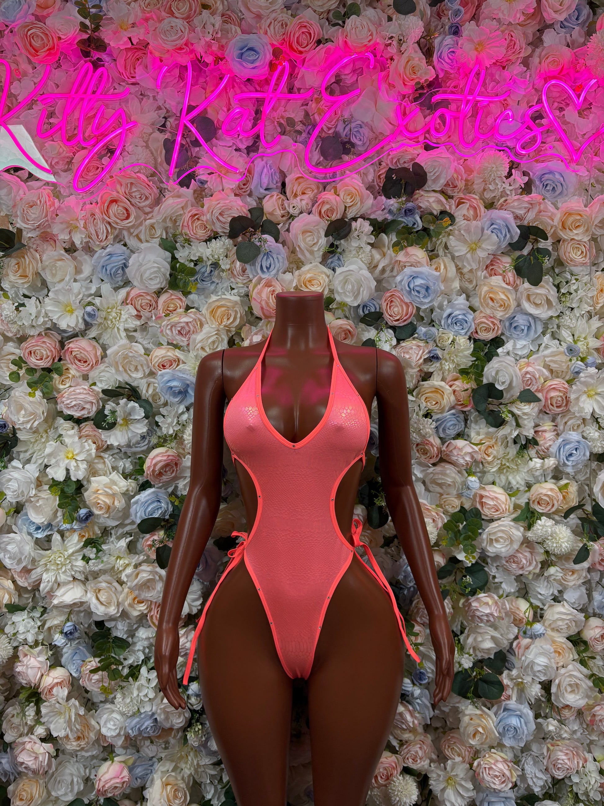 Coral metallic one-piece bodysuit with V-neck and high-leg cut