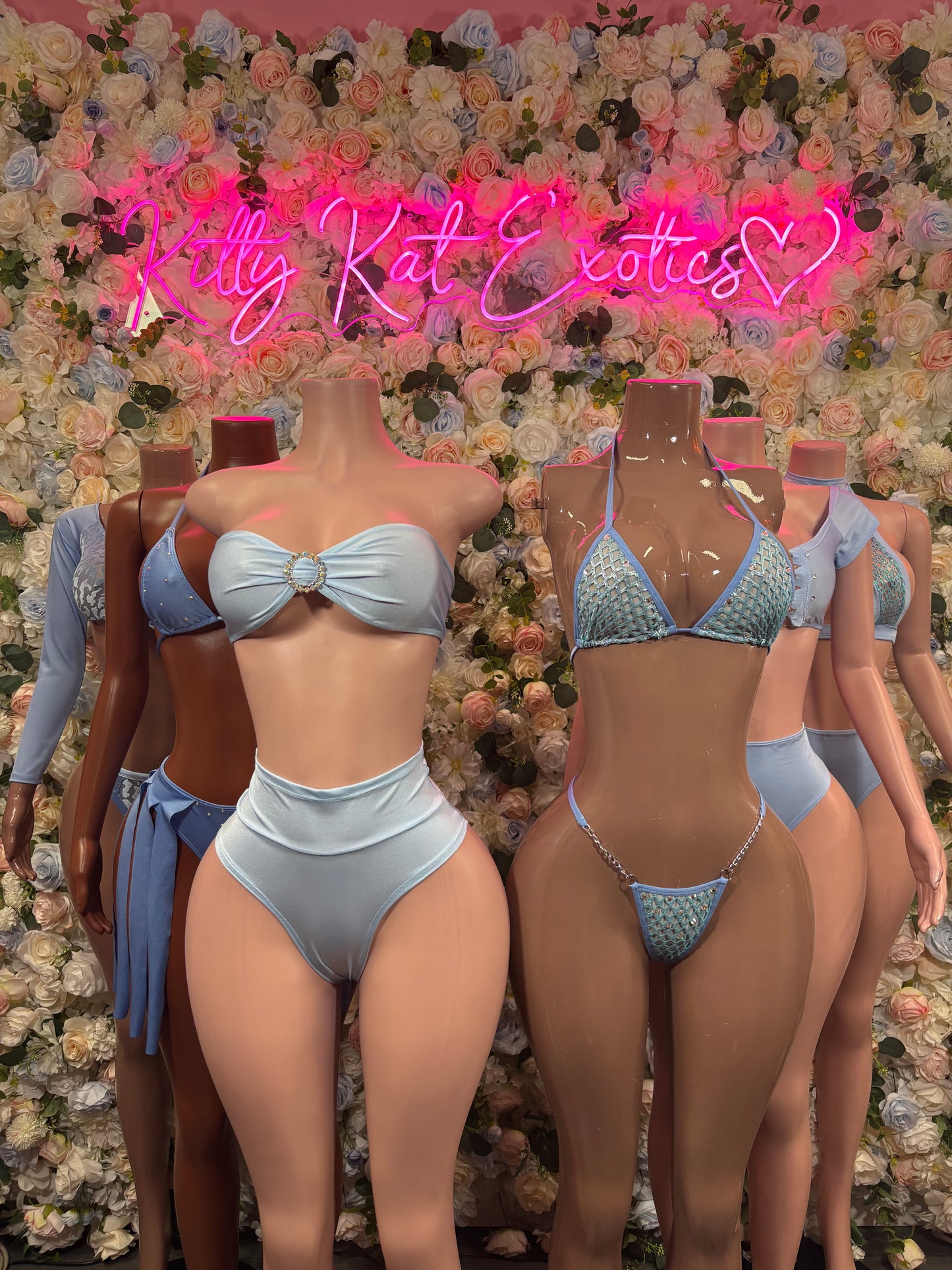 Baby blue rave two-piece outfits on models, halter tops and high-waist bottoms
