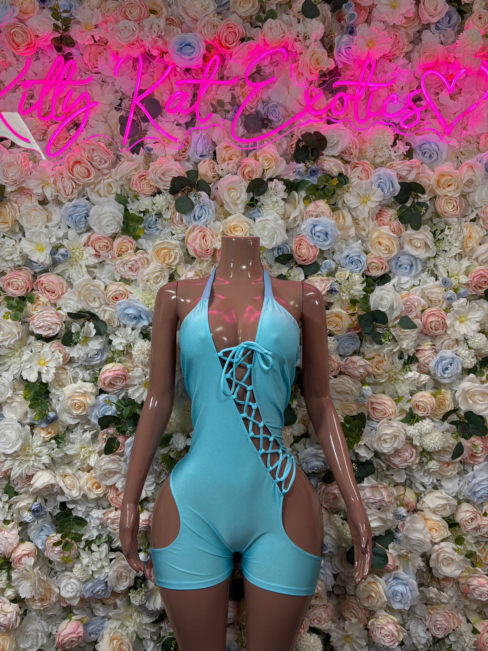 Teal lace-up bodysuit with cutout front and cheeky shorts