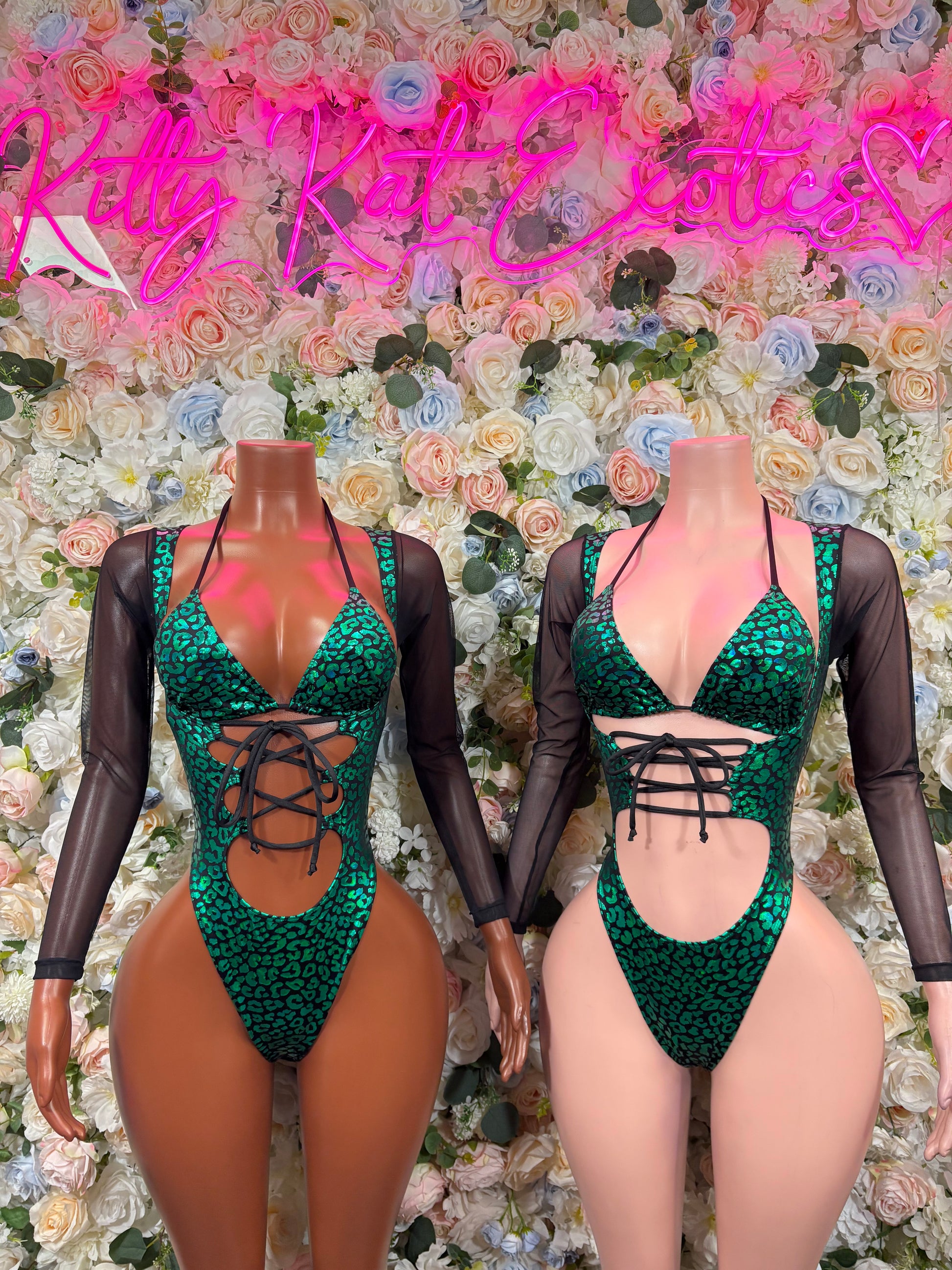 Green cheetah bodysuit with crisscross lace-up front; matching sheer sleeves