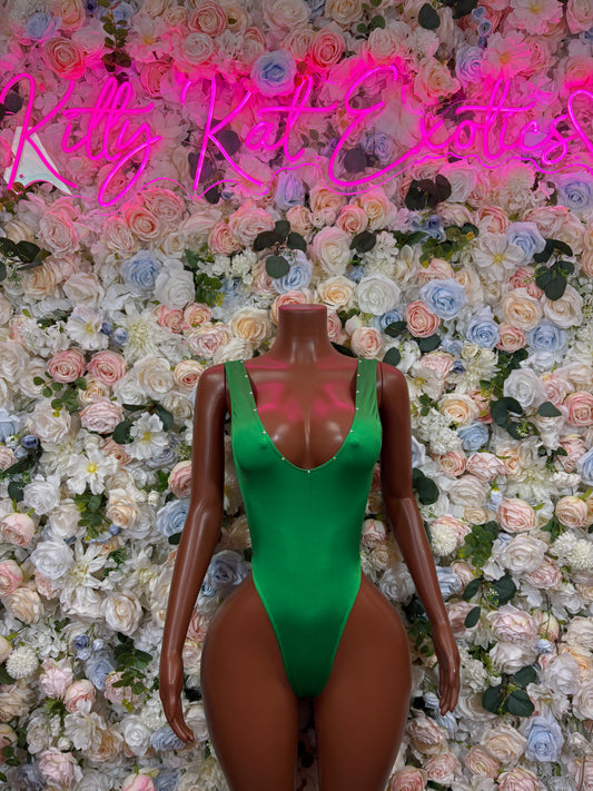 Green sleeveless dancewear bodysuit with deep V neckline on mannequin