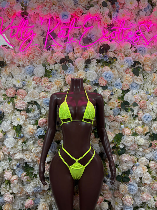 Neon green triangle bikini set on mannequin, neon straps and matching bottoms