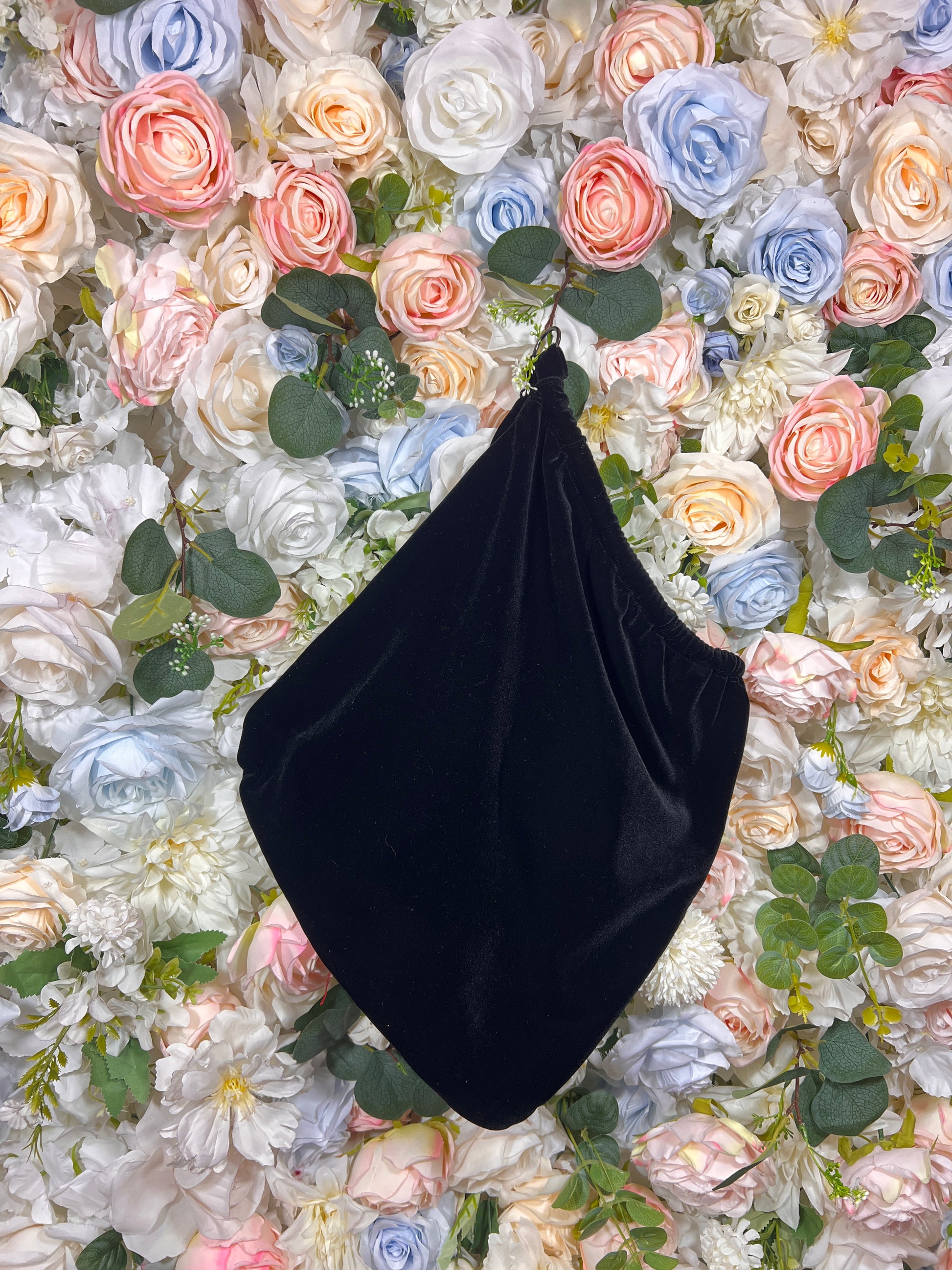 Black velvet money bag pouch with rounded shape and wide opening