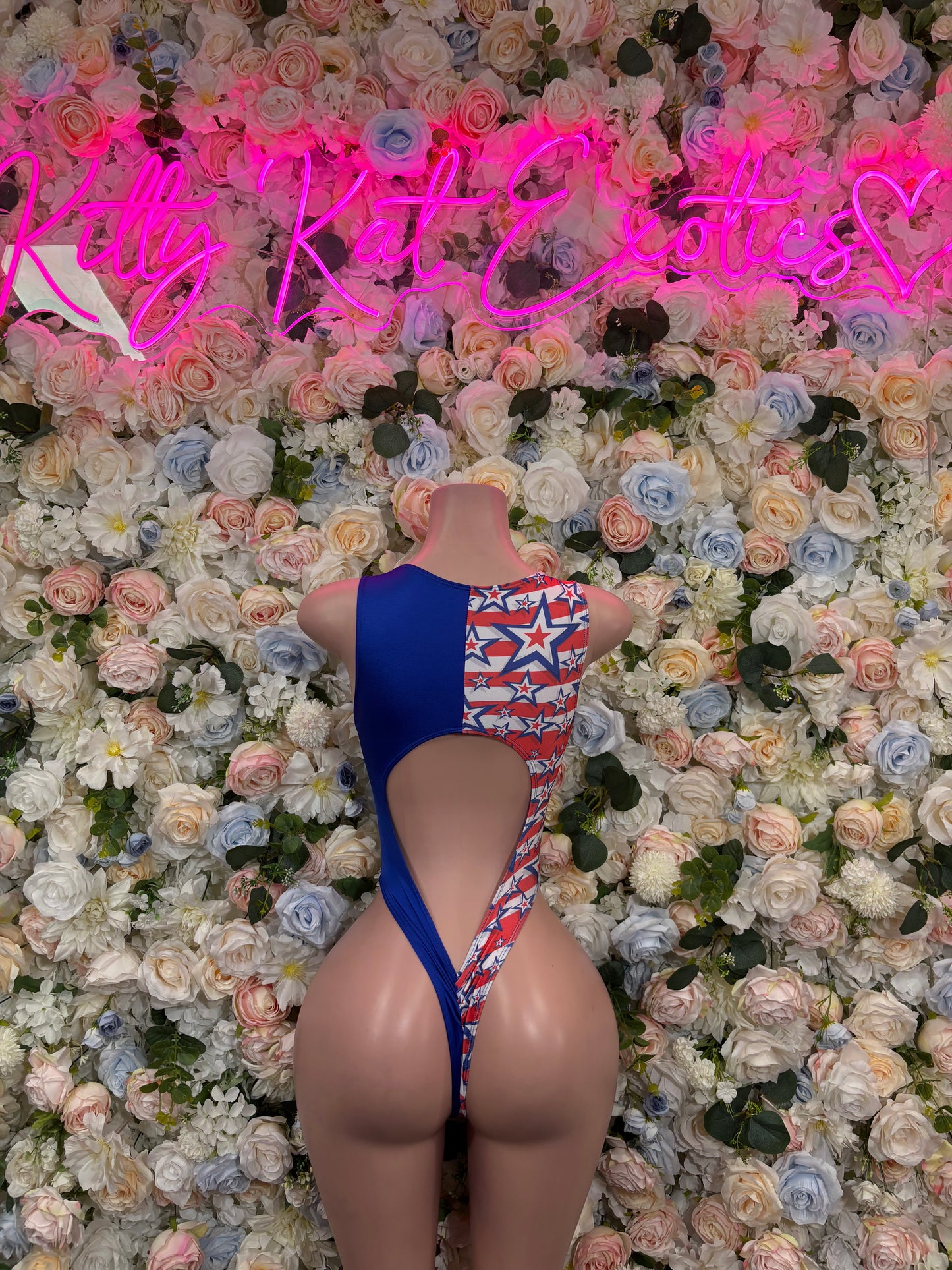 Patriotic flag star bodysuit with lace-up back and high-cut legs, blue and red