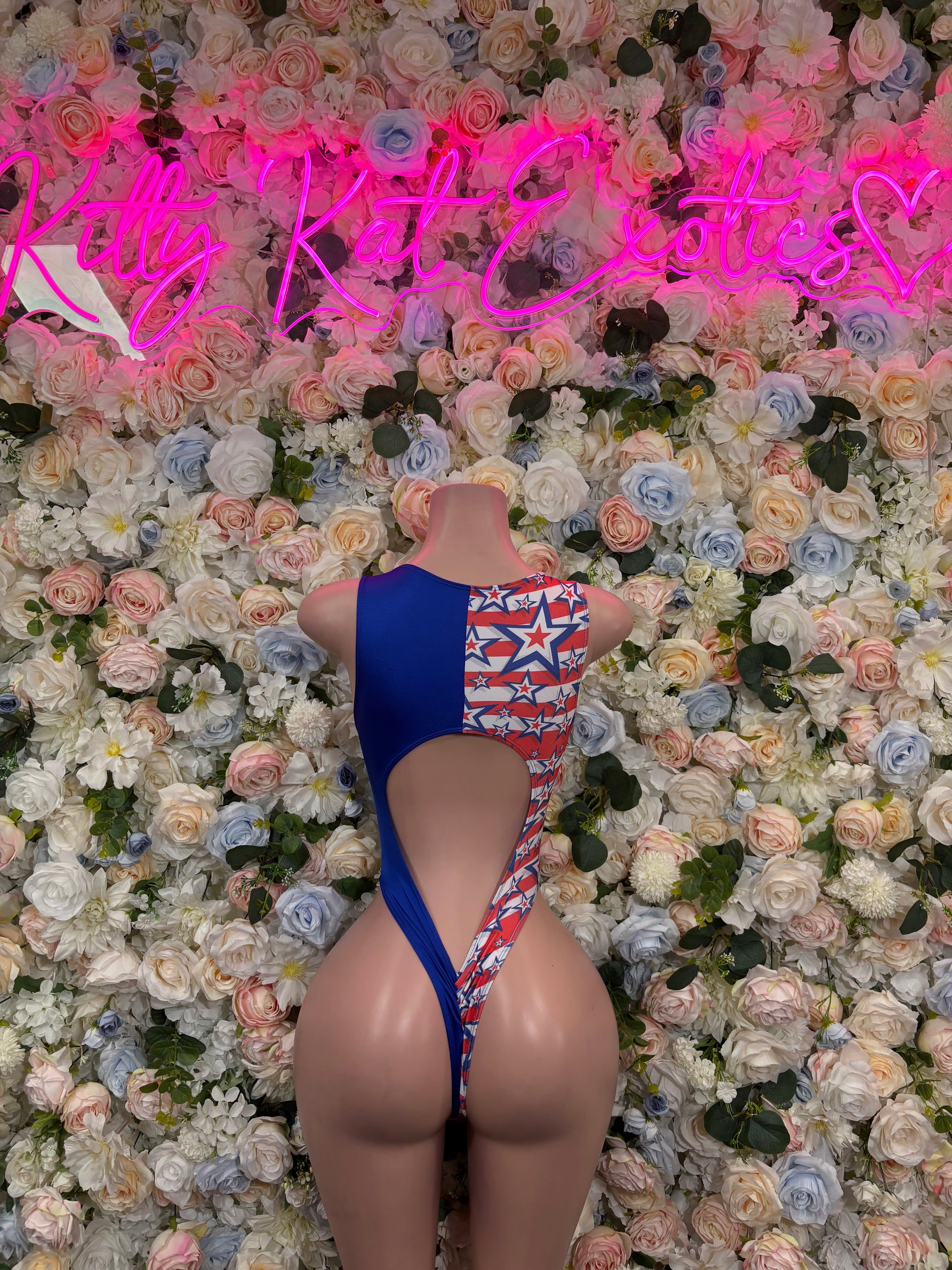 Patriotic flag star bodysuit with lace-up back and high-cut legs, blue and red