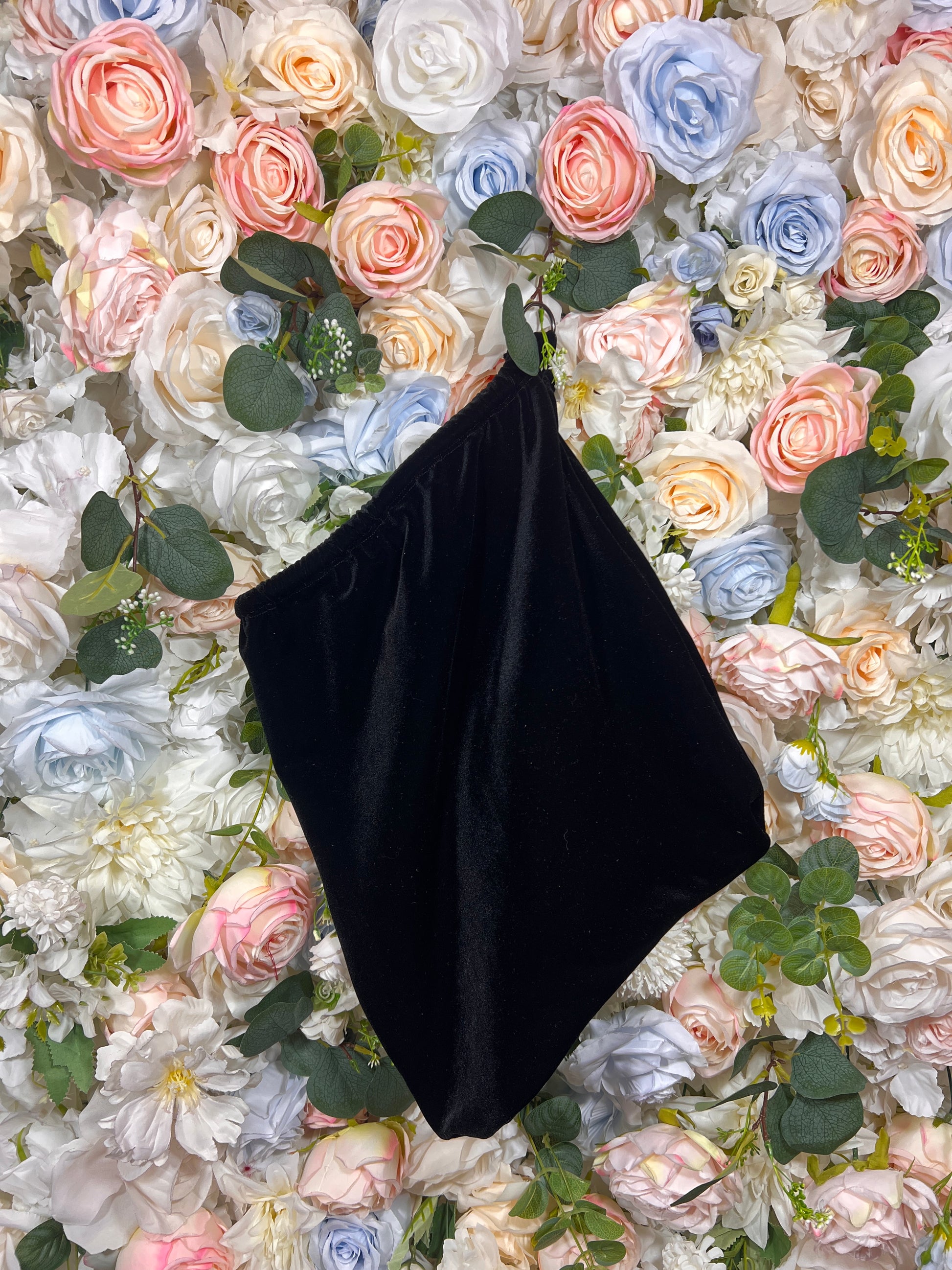 Black velvet money bag pouch, angled view with curved open top