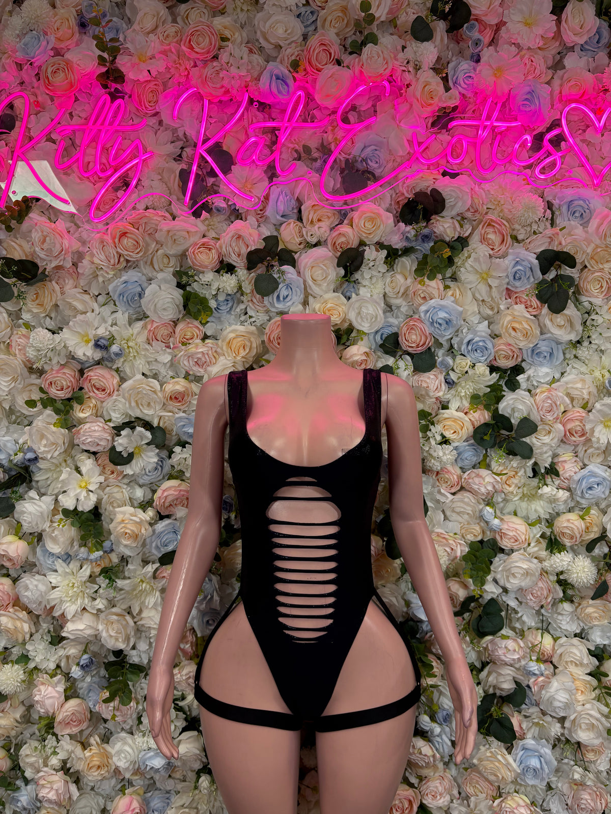 Black bodysuit with cutout chest design and high-cut legs