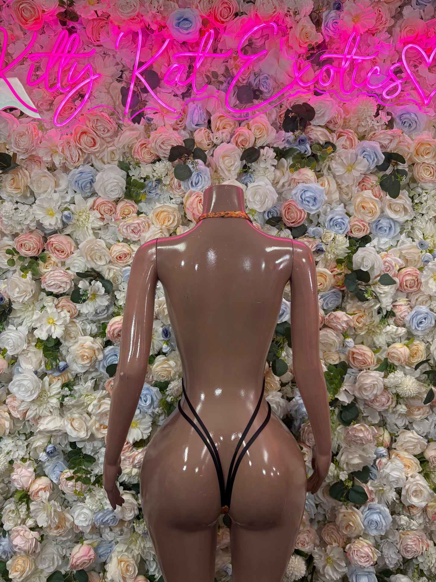 Orange snake-print one-piece bodysuit with open back and thong bottom