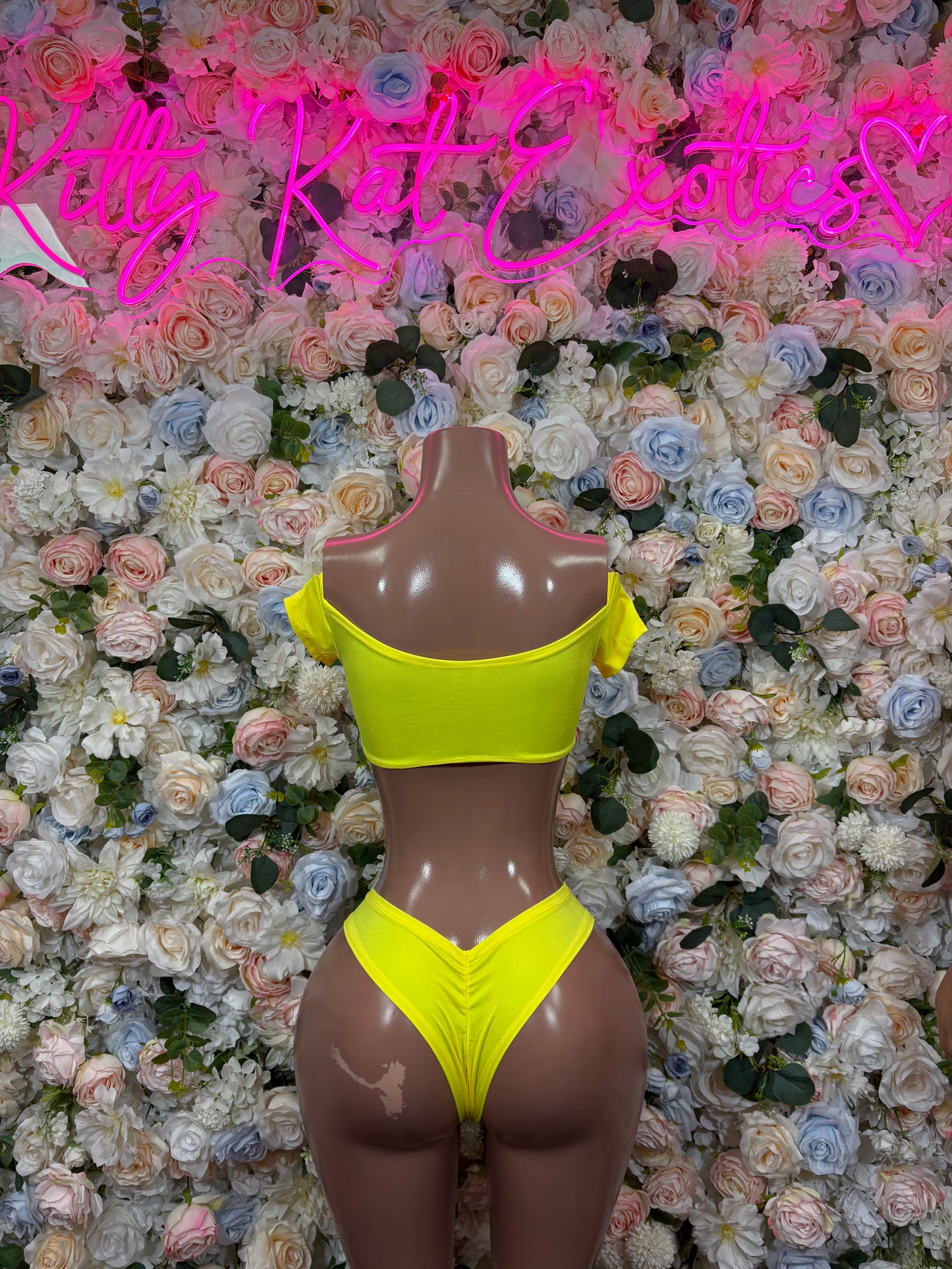 Women's yellow bikini set with strappy triangle top and cheeky high-cut bottoms