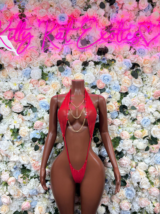 Red V-neck bodysuit with chain details and high-cut string back
