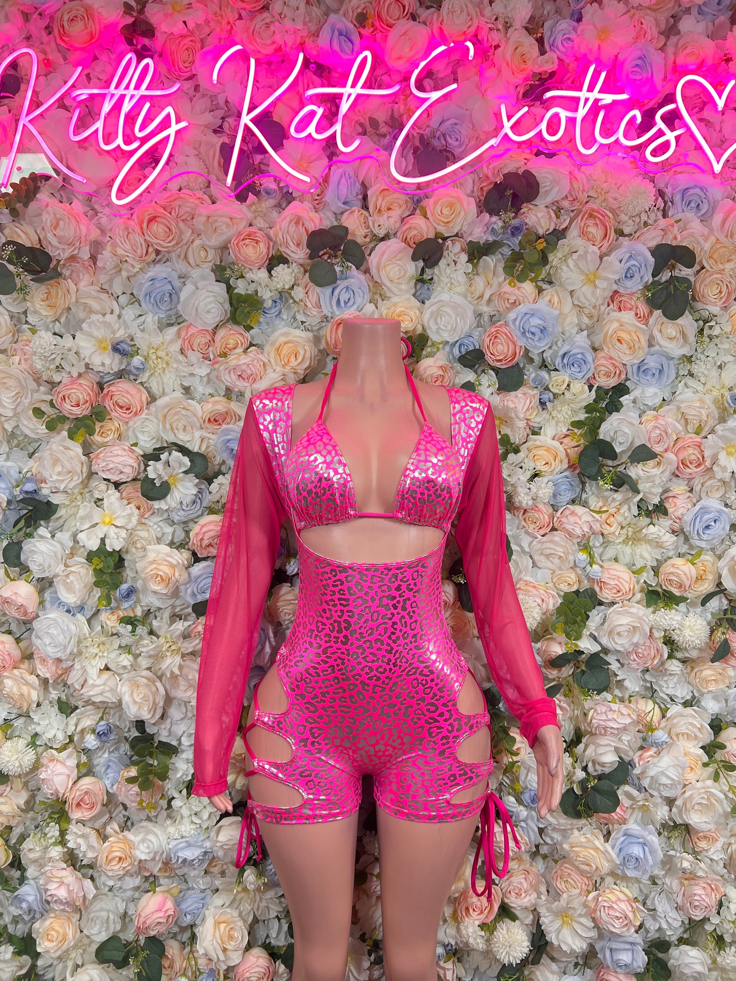 Hot pink metallic cheetah bodysuit with triangle top, shorts, and tie sides